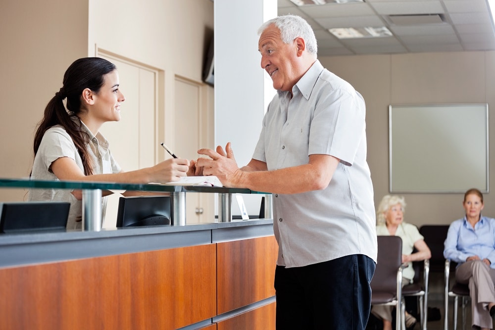 A patient talks to a financing coordinator